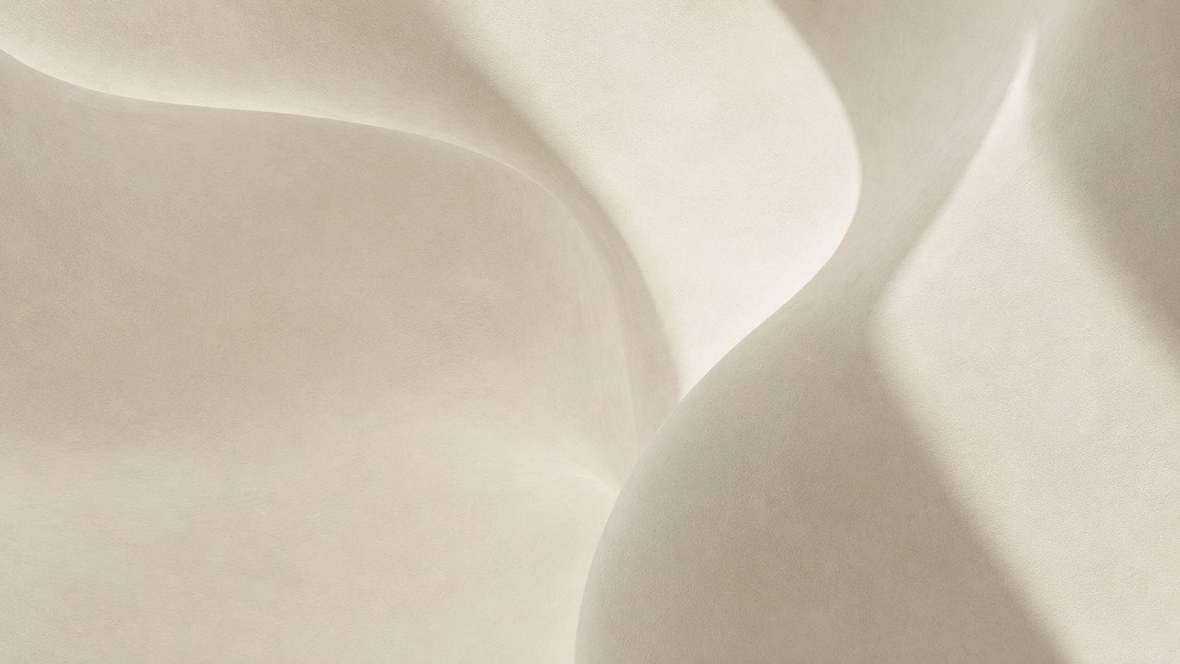 Abstract architectural curves in warm, textured stone